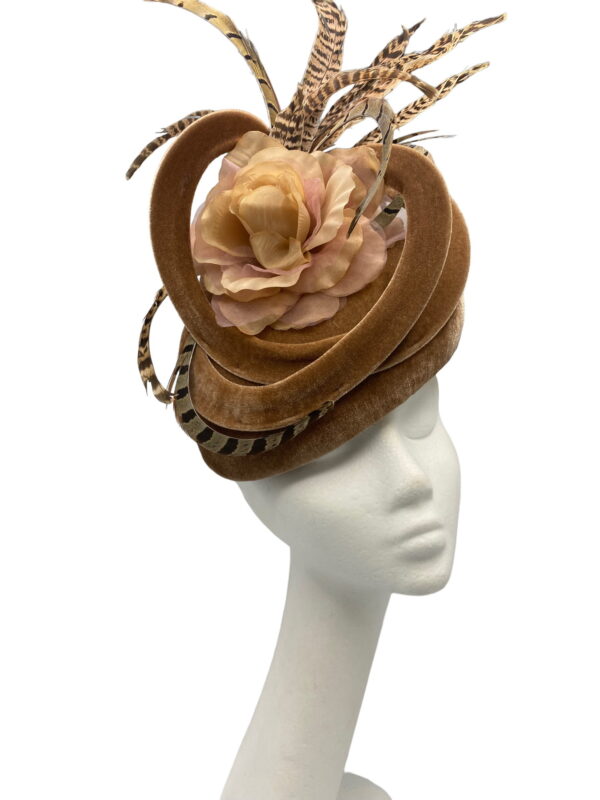 Beige/tan coloured velvet teardrop headpiece with swirl detail and completed with beautiful brown feathers.